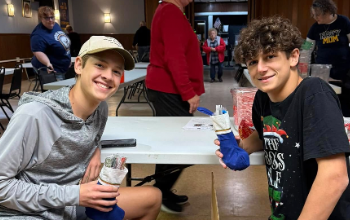 Collin stuffs stockings to send to sailors