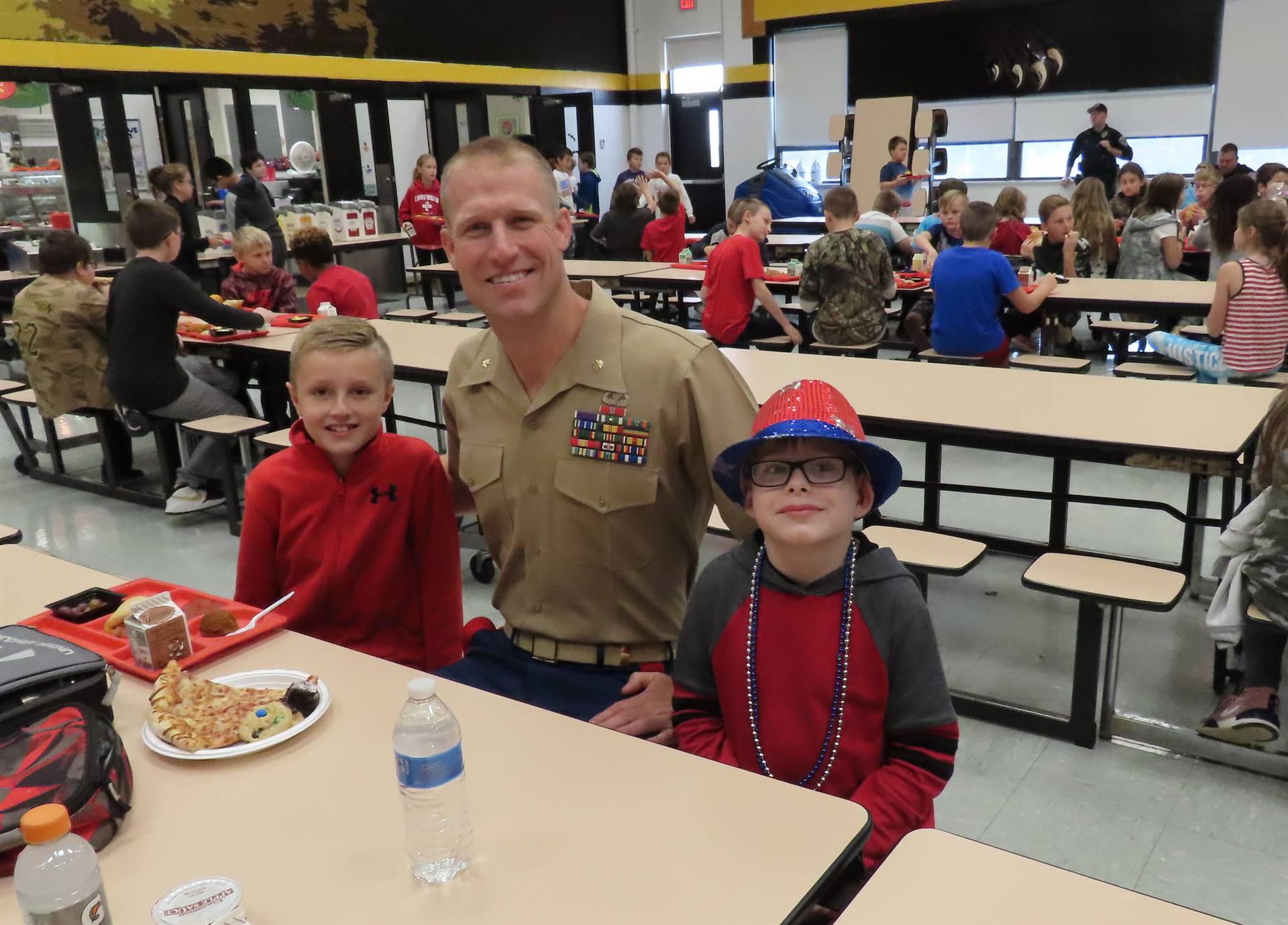 Police officer and son with friend