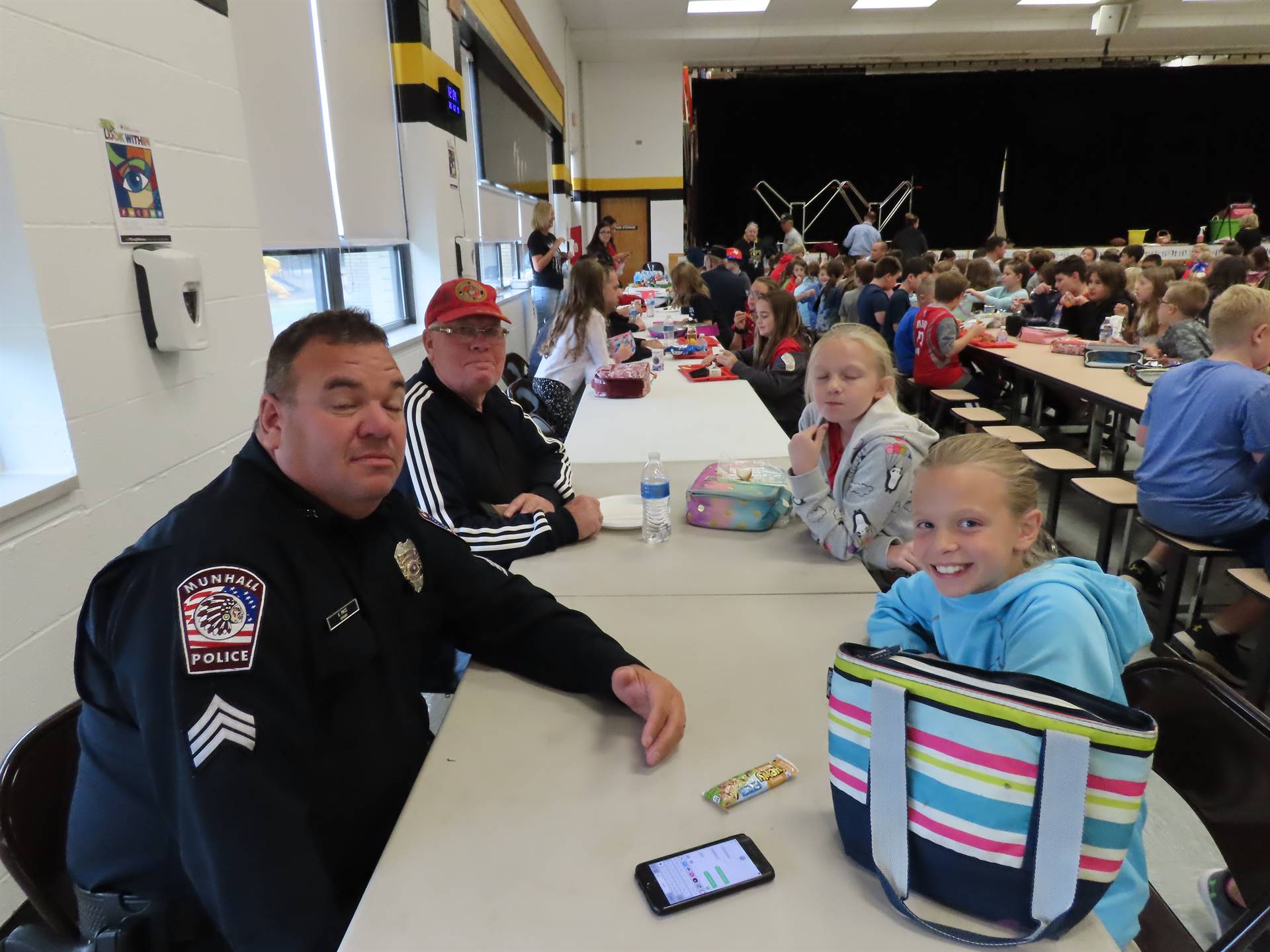 Police officer at lunch table