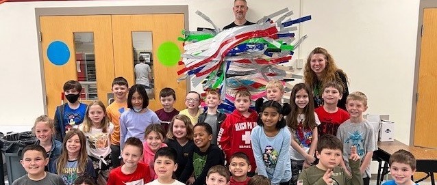 Mr. Liberatore taped to the wall by students